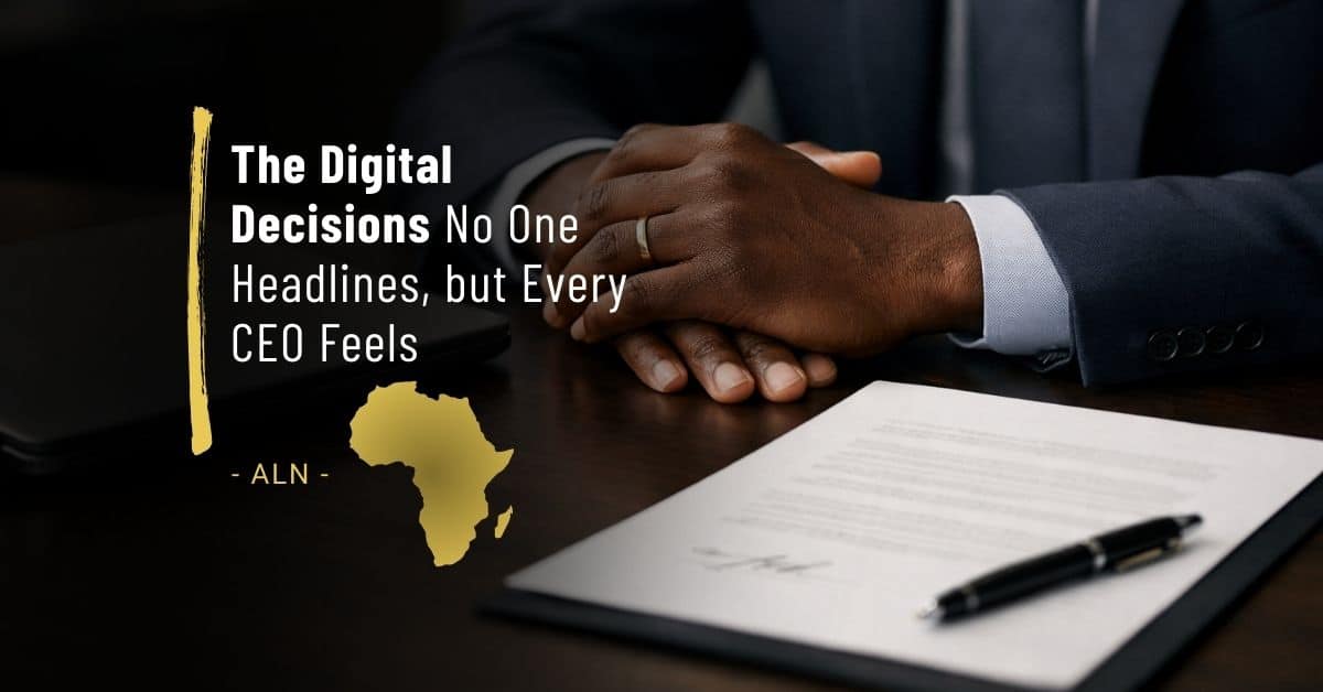 Close-up of an African business executive’s hands resting on a desk beside a laptop and signed document, symbolising formal decision-making and long-term commitments.