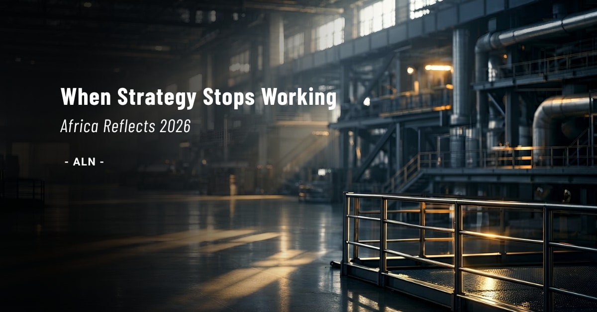 An empty industrial facility with steel structures and controlled lighting, representing strategic reflection in complex business environments. Africa Reflects 2026 editorial image on African leadership, first-principles thinking, and decision-making under market uncertainty.